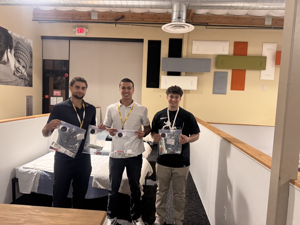 Team members with donated hygiene kits